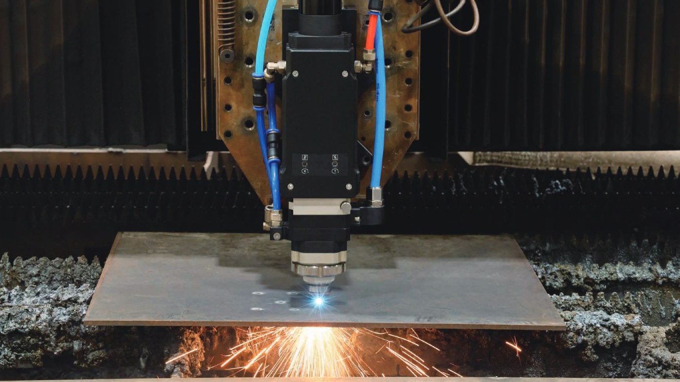 BLT laser cutting head cutting steel sheet with sparks